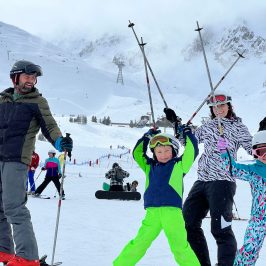 a group of people skiing on the snow