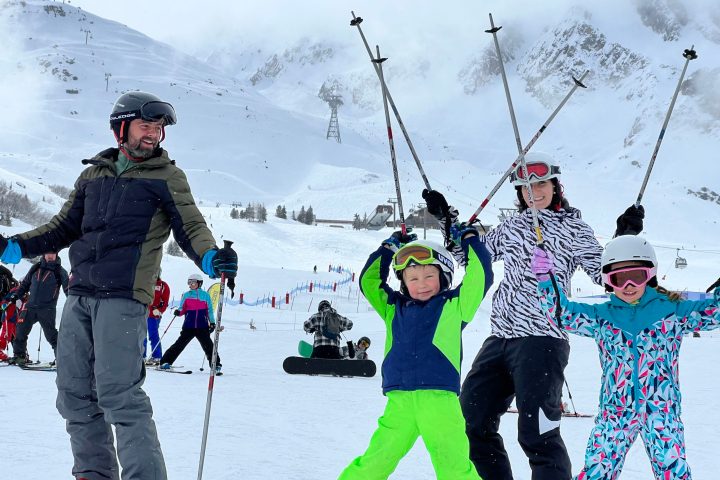 a group of people skiing on the snow